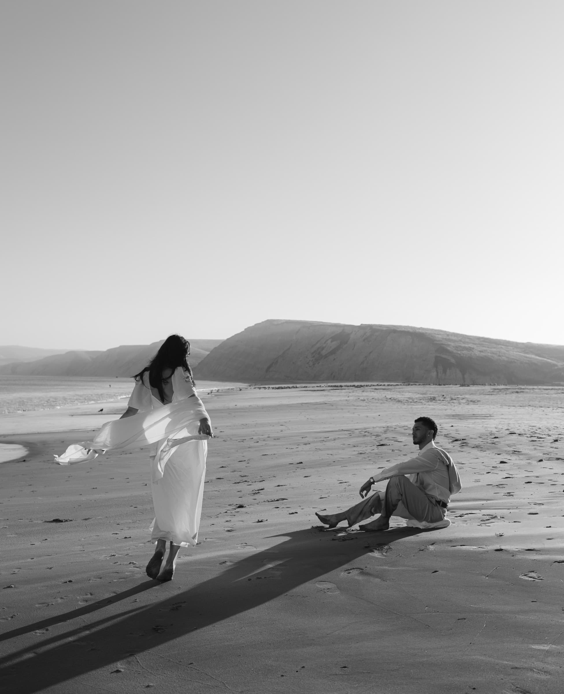 Berkeley and Robin in golden-hour light at Drake's Beach